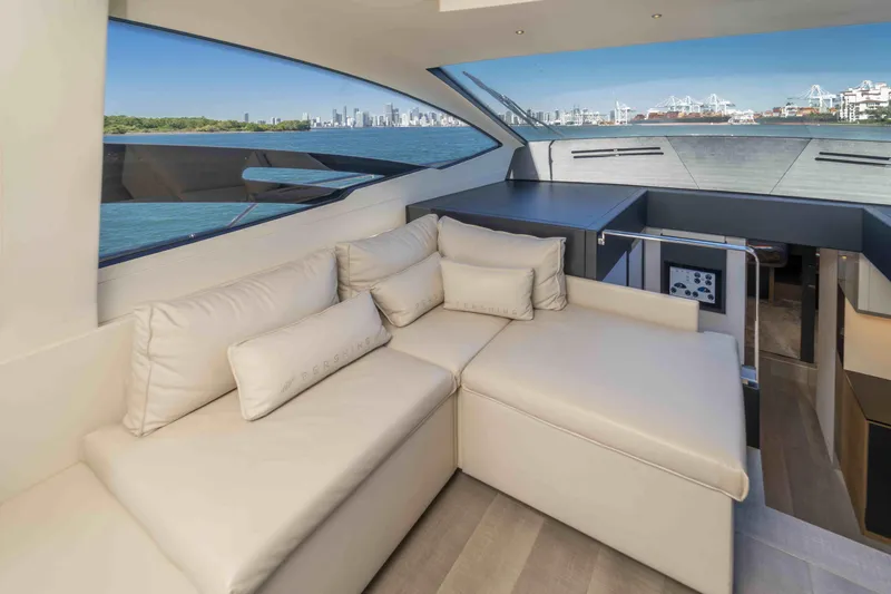 Slide: The Image of Luxurious interior of 2018 Pershing 70 yacht with city skyline view. - 13