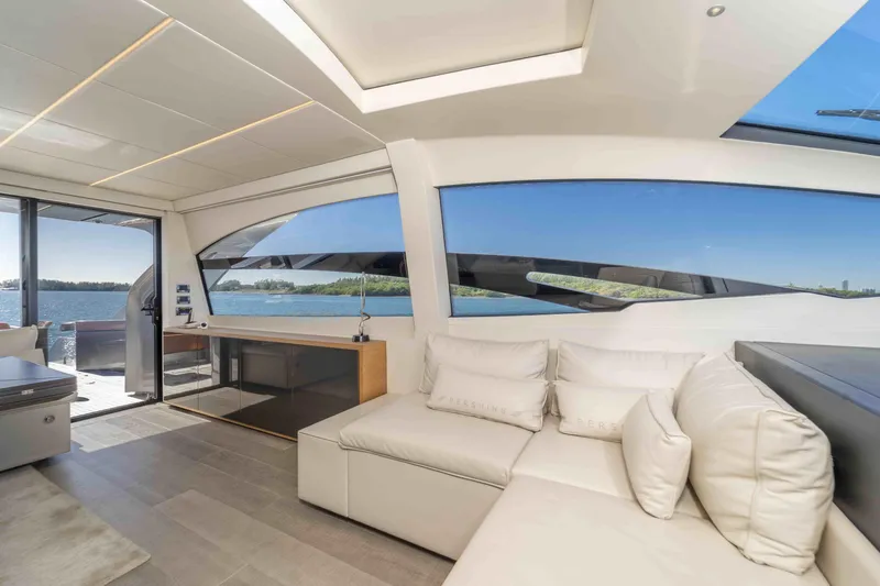 Slide: The Image of Luxurious interior of 2018 Pershing 70 yacht with panoramic windows and elegant seating. - 14