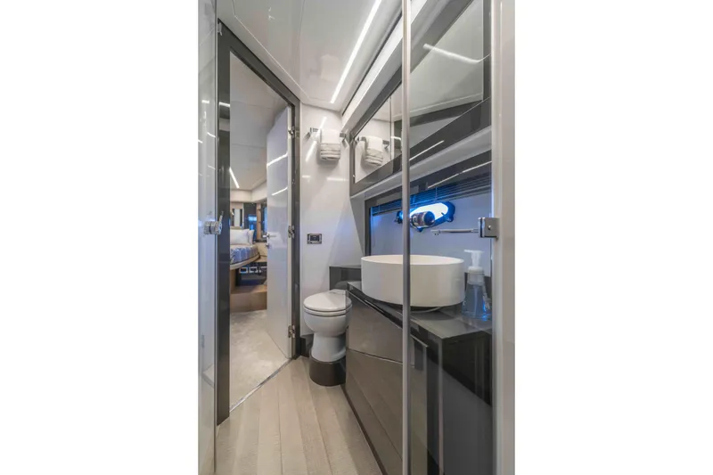 Slide: The Image of Luxurious bathroom interior on a 2018 Pershing 70 yacht, featuring modern fixtures. - 16