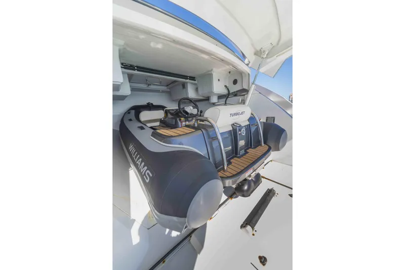 Slide: The Image of 2018 Pershing 70 yacht with Williams Turbojet tender in storage compartment. - 20