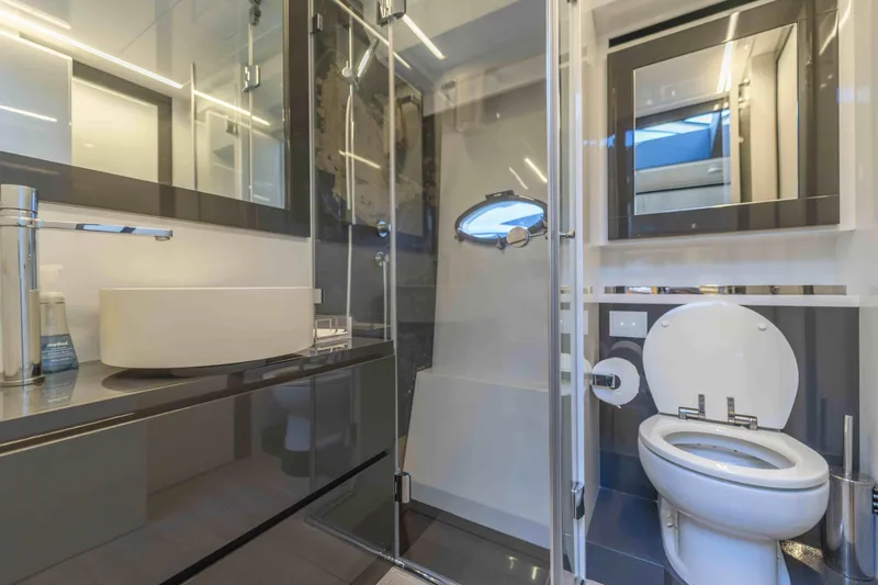 Slide: The Image of Luxurious bathroom in a 2018 Pershing 70 yacht with modern fixtures and sleek design. - 21