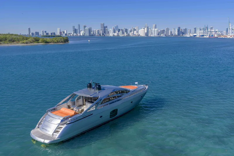 Slide: The Image of 2018 Pershing 70 yacht on blue water with city skyline in background. - 28