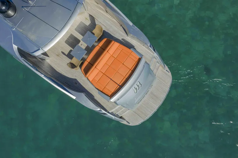 Slide: The Image of Aerial view of 2018 Pershing 70 yacht with sunbathing area on turquoise water. - 29