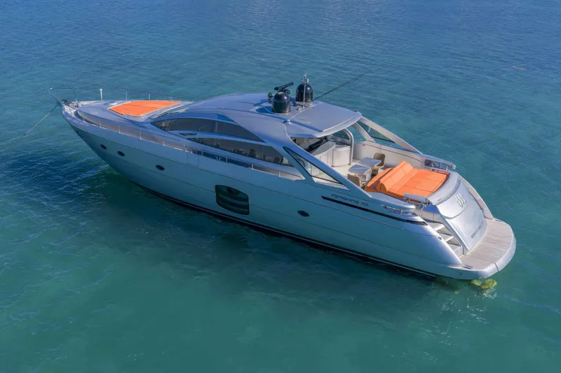 Slide: The Image of 2018 Pershing 70 yacht on clear blue water, showcasing sleek design and luxury features. - 32