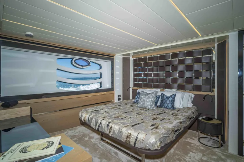 Slide: The Image of Luxurious bedroom interior of 2018 Pershing 70 yacht with modern design and ocean view. - 4