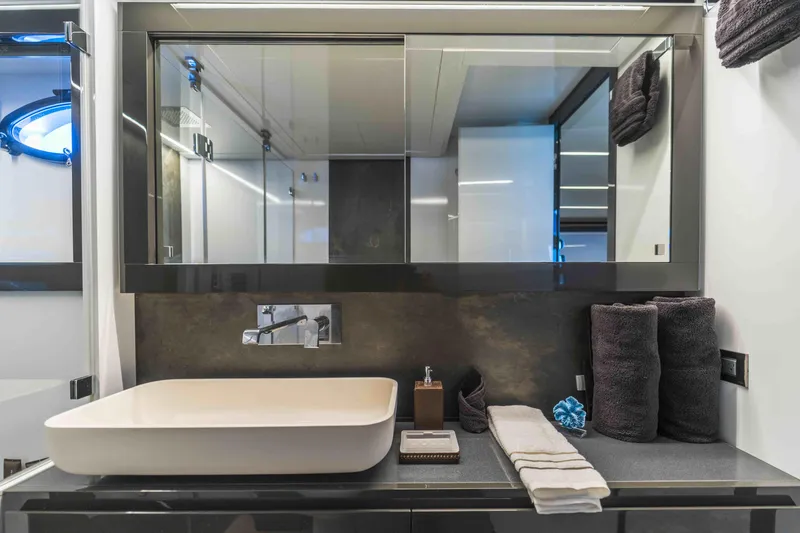 Slide: The Image of Luxurious bathroom interior of 2018 Pershing 70 yacht with modern sink and mirror. - 5