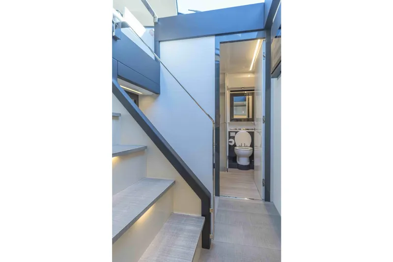 Slide: The Image of Interior of 2018 Pershing 70 yacht showing stairs and bathroom. - 8