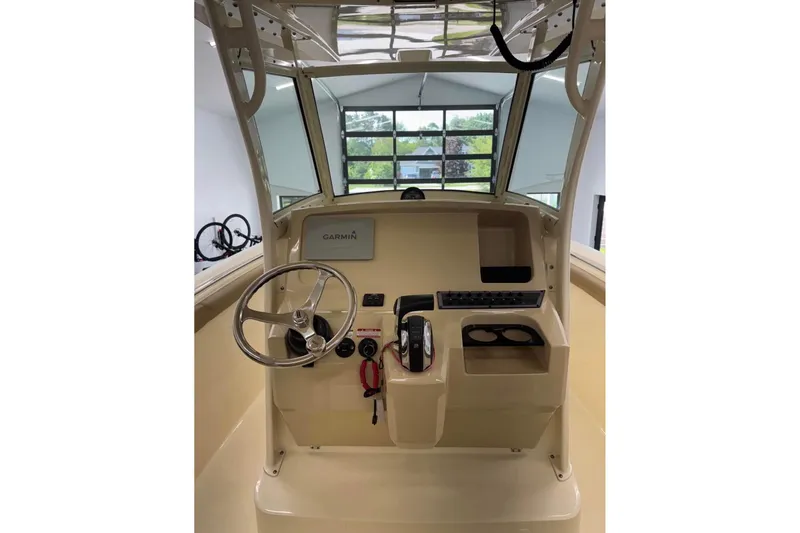 Slide: The Image of 2016 Scout 255 LXF boat helm with Garmin navigation system and steering wheel. - 15