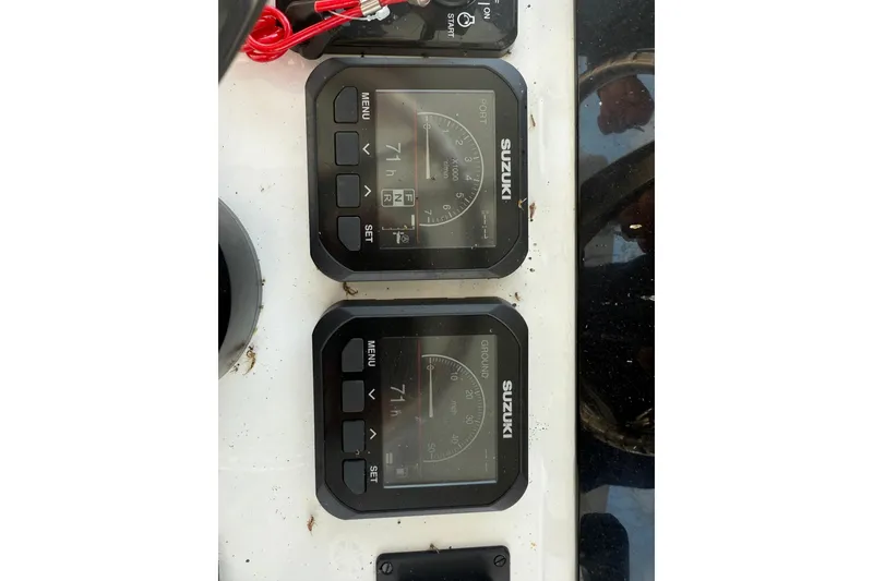 Slide: The Image of 2023 Stamas 31T Aventura boat dashboard with Suzuki digital displays. - 15