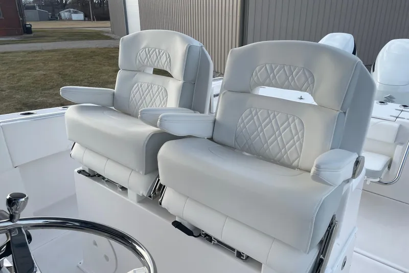 Slide: The Image of 2023 Stamas 31T Aventura boat with luxurious white seating and armrests. - 21