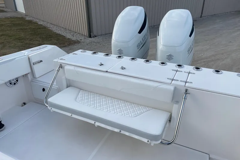 Slide: The Image of 2023 Stamas 31T Aventura boat with dual Suzuki engines and foldable seating. - 22