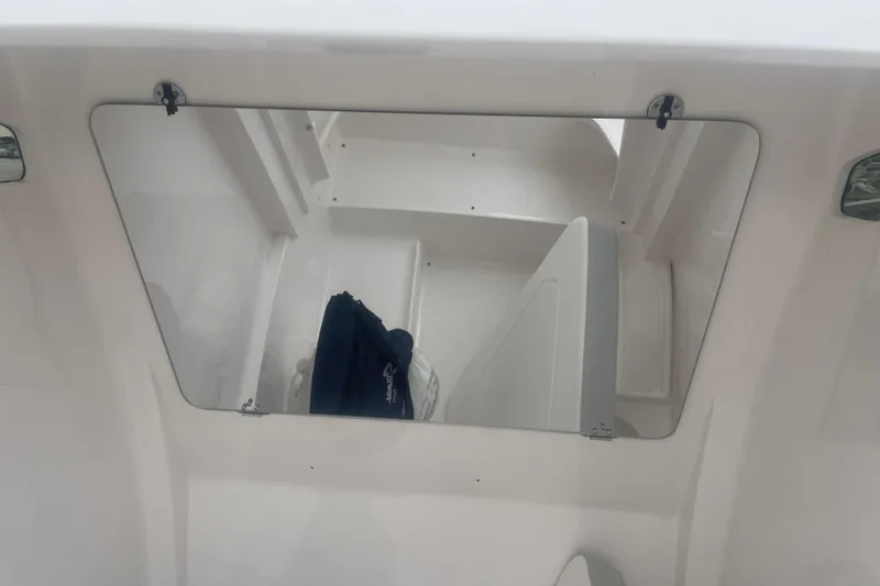 Slide: The Image of 2023 Stamas 31T Aventura boat interior with storage compartment and clothing. - 25