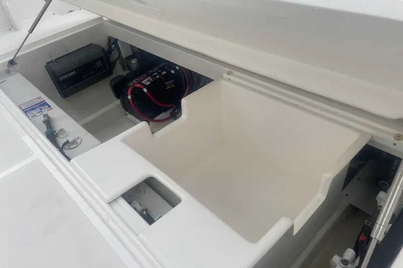 Slide: The Image of 2023 Stamas 31T Aventura boat storage compartment with battery and equipment. - 29