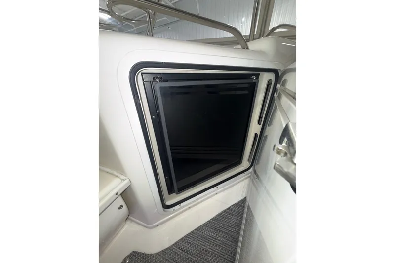 Slide: The Image of 2001 Sea Ray 560 Sedan Bridge interior hatch with sleek design and modern finish. - 24