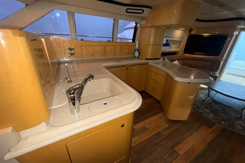 Slide: The Image of Luxurious interior of a 2001 Sea Ray 560 Sedan Bridge yacht kitchen area. - 27