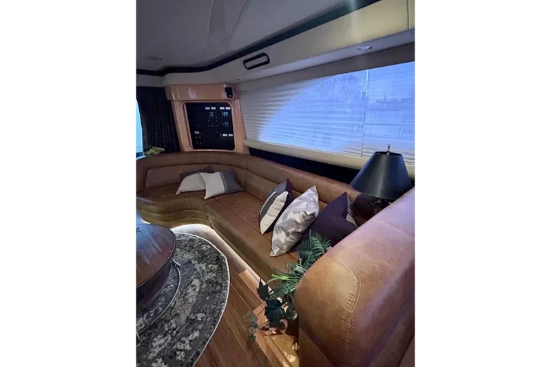 Slide: The Image of Luxurious interior of 2001 Sea Ray 560 Sedan Bridge with plush seating and elegant decor. - 29