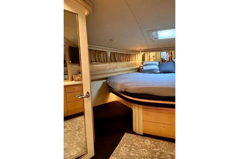 Slide: The Image of Luxurious bedroom interior of 2001 Sea Ray 560 Sedan Bridge yacht. - 34