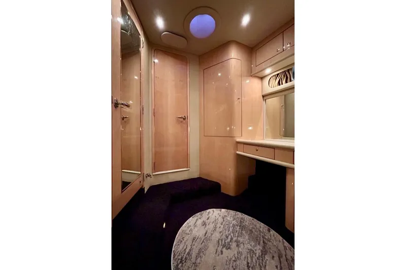 Slide: The Image of Luxurious interior of 2001 Sea Ray 560 Sedan Bridge yacht with elegant wood finishes. - 38