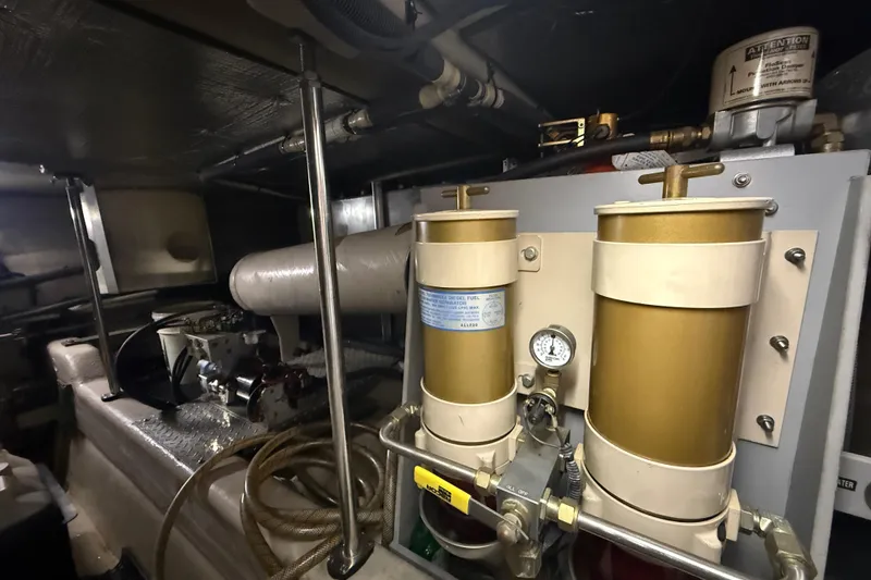Slide: The Image of Engine room of 2001 Sea Ray 560 Sedan Bridge with fuel filtration system. - 49