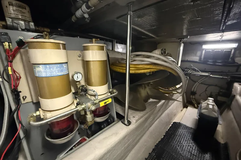 Slide: The Image of Engine room of 2001 Sea Ray 560 Sedan Bridge with fuel filters and propeller. - 50