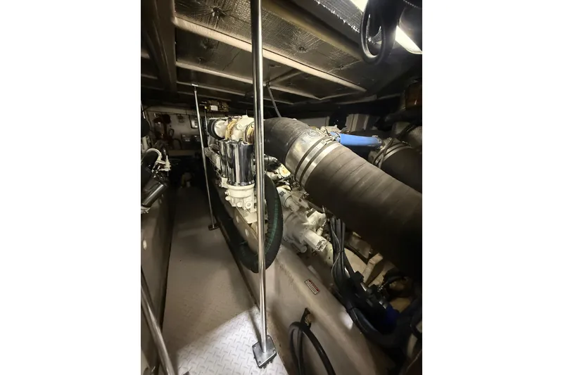 Slide: The Image of Engine room of 2001 Sea Ray 560 Sedan Bridge yacht, showcasing mechanical components. - 51