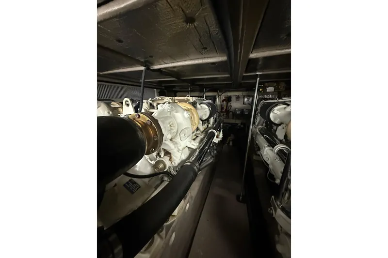 Slide: The Image of Engine room of 2001 Sea Ray 560 Sedan Bridge yacht, showcasing dual engines. - 52