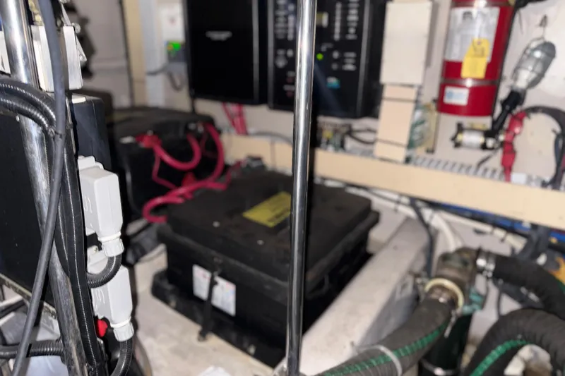 Slide: The Image of Engine room of 2001 Sea Ray 560 Sedan Bridge with wiring and equipment. - 57