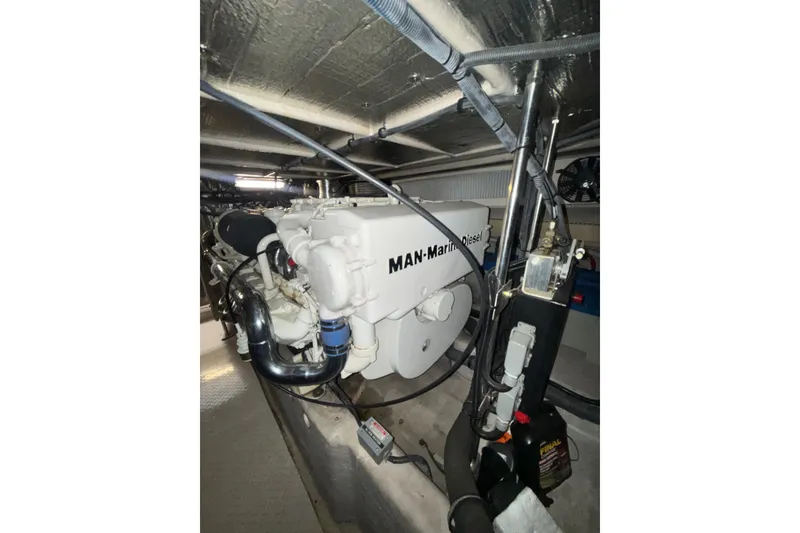 Slide: The Image of Engine room of 2001 Sea Ray 560 Sedan Bridge with MAN Marine Diesel engine. - 64