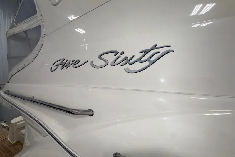 Slide: The Image of 2001 Sea Ray 560 Sedan Bridge yacht with "Five Sixty" script on hull. - 9