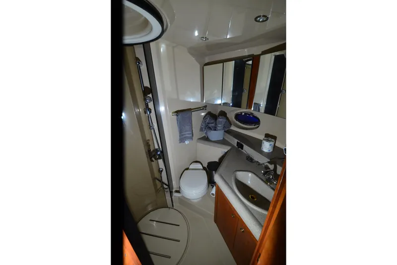 Slide: The Image of 2003 Cruisers Yachts 4370 Express bathroom with shower, sink, and toilet. - 20