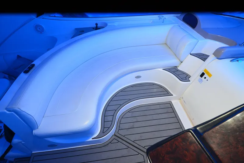 Slide: The Image of Luxurious seating area on 2003 Cruisers Yachts 4370 Express, featuring elegant white upholstery. - 28