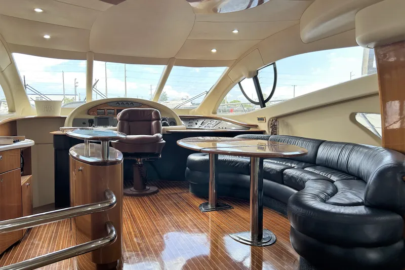 Slide: The Image of Luxurious interior of a 2003 Azimut 55 yacht with leather seating and polished wood finishes. - 4