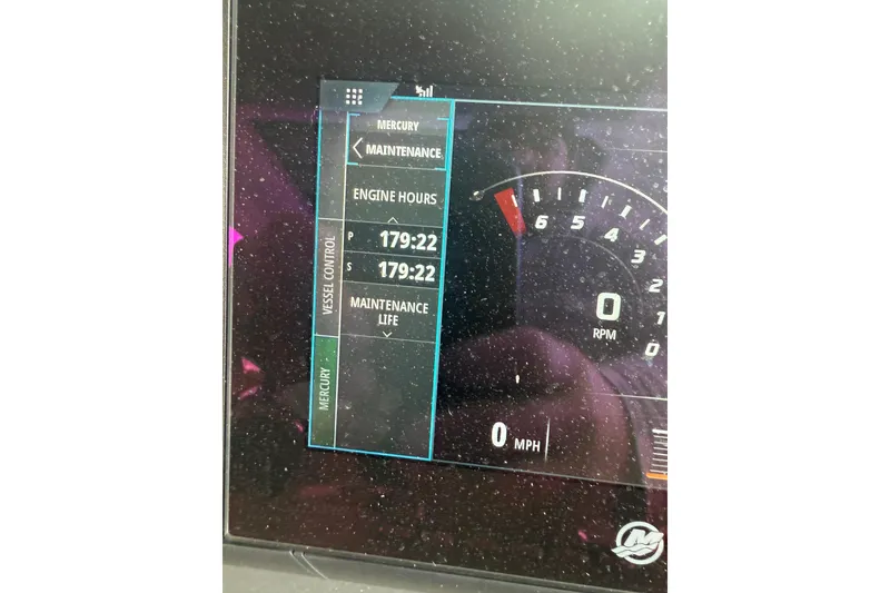 Slide: The Image of Dashboard of 2018 Axopar 37 Sun-Top showing engine hours and RPM gauge. - 8