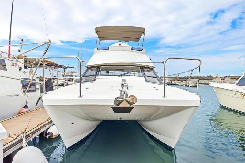 Slide: The Image of 2023 ArrowCat 420 Flybridge yacht docked in marina, front view. - 17