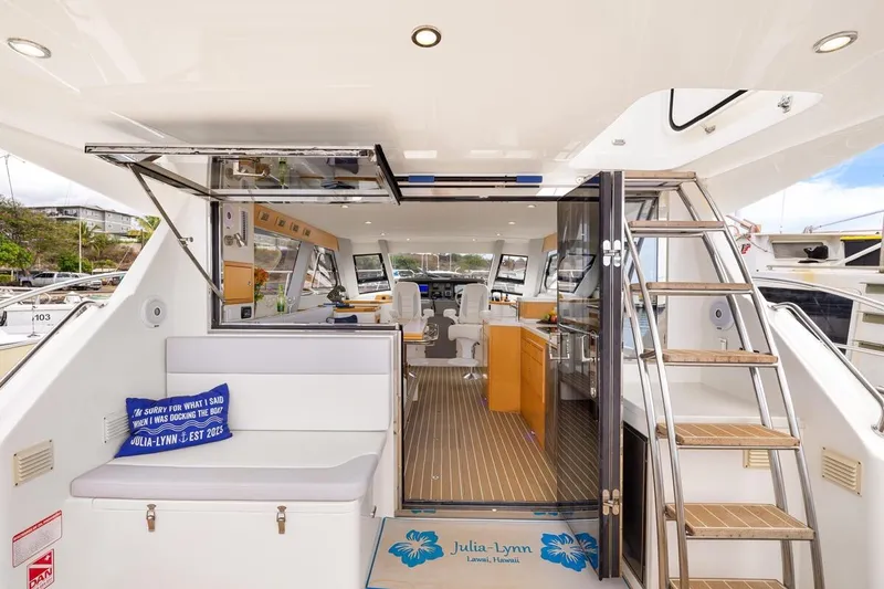 Slide: The Image of 2023 ArrowCat 420 Flybridge interior with seating, stairs, and modern design elements. - 22