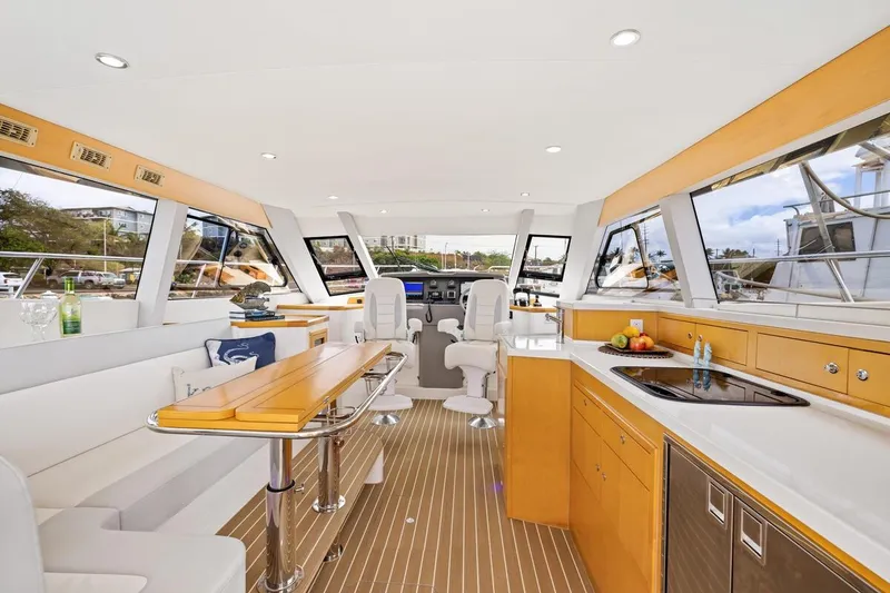 Slide: The Image of Luxurious interior of 2023 ArrowCat 420 Flybridge yacht with modern kitchen and seating area. - 23
