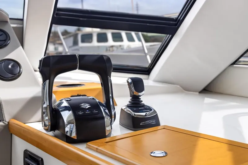 Slide: The Image of Control panel of 2023 ArrowCat 420 Flybridge with Suzuki throttle and Optimus joystick. - 29