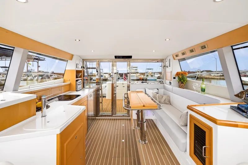 Slide: The Image of Luxurious interior of 2023 ArrowCat 420 Flybridge yacht with modern kitchen and seating area. - 32