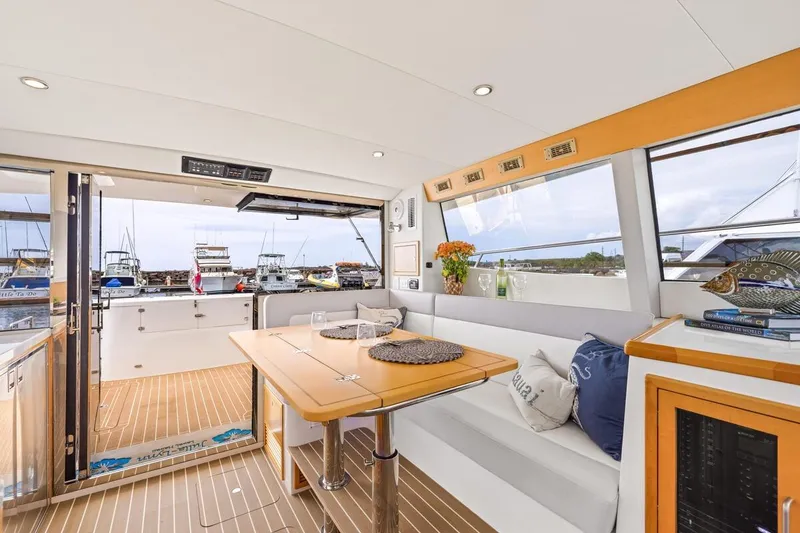 Slide: The Image of Luxurious interior of 2023 ArrowCat 420 Flybridge yacht with elegant seating and dining area. - 33