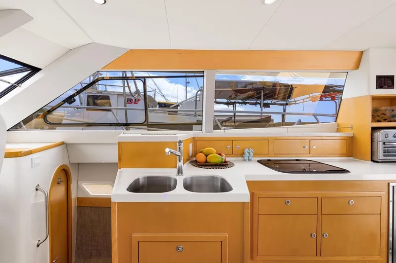 Slide: The Image of Modern kitchen interior of 2023 ArrowCat 420 Flybridge yacht with sleek design and ample storage. - 43