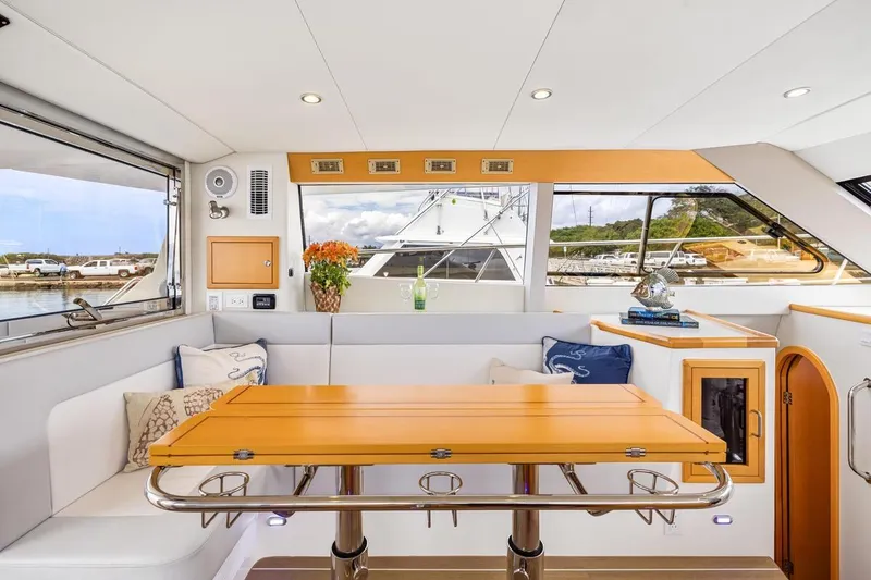 Slide: The Image of Luxurious interior of 2023 ArrowCat 420 Flybridge yacht with elegant seating and table. - 46