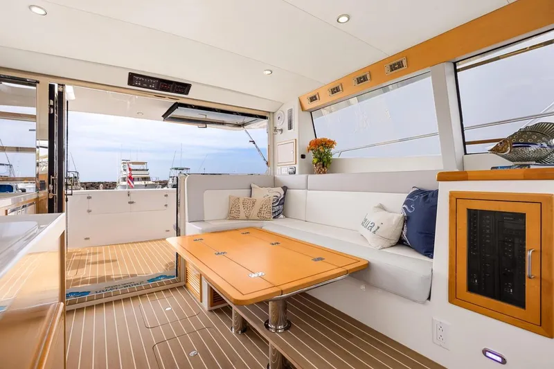 Slide: The Image of Luxurious interior of 2023 ArrowCat 420 Flybridge yacht with elegant seating and wooden accents. - 47