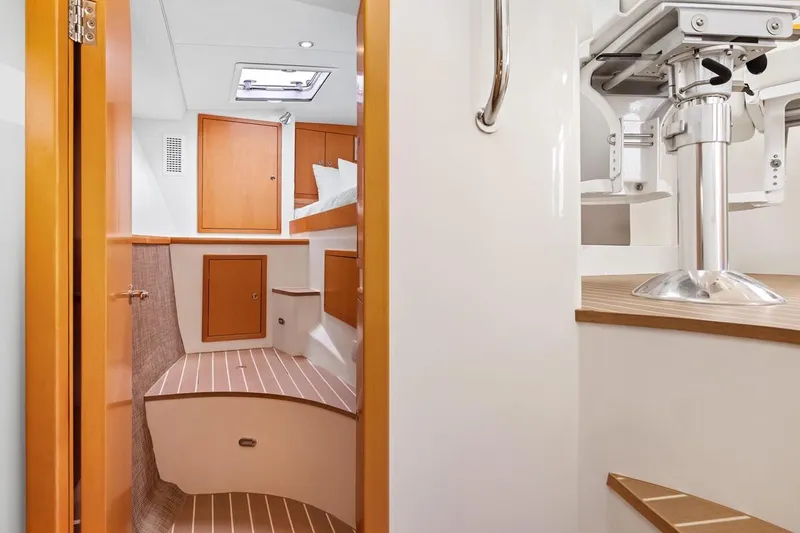 Slide: The Image of 2023 ArrowCat 420 Flybridge interior with wooden cabinetry and modern design. - 53