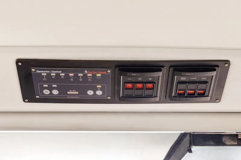 Slide: The Image of Control panel of 2023 ArrowCat 420 Flybridge with Fischer Panda generator controls. - 55