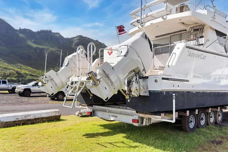 Slide: The Image of 2023 ArrowCat 420 Flybridge yacht on trailer, scenic mountain backdrop. - 70