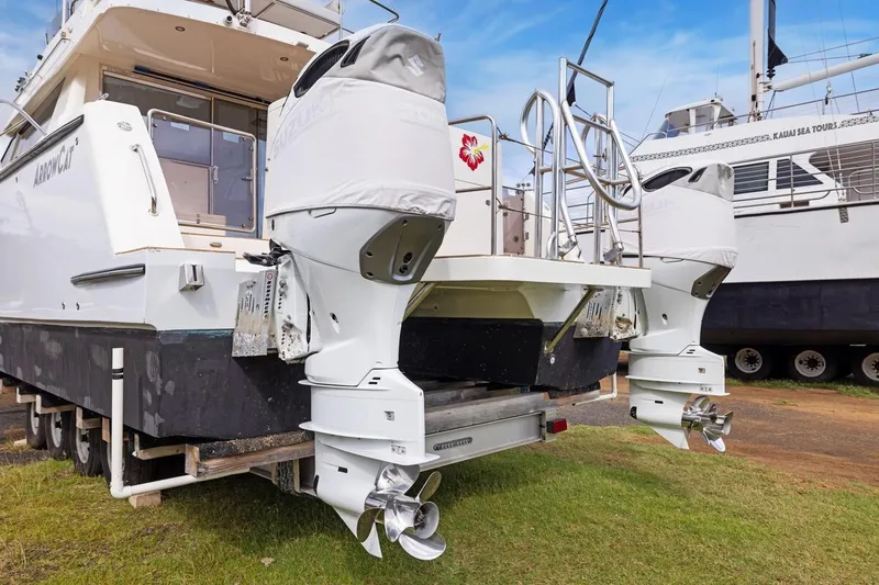 Slide: The Image of 2023 ArrowCat 420 Flybridge boat with dual outboard motors on display. - 71