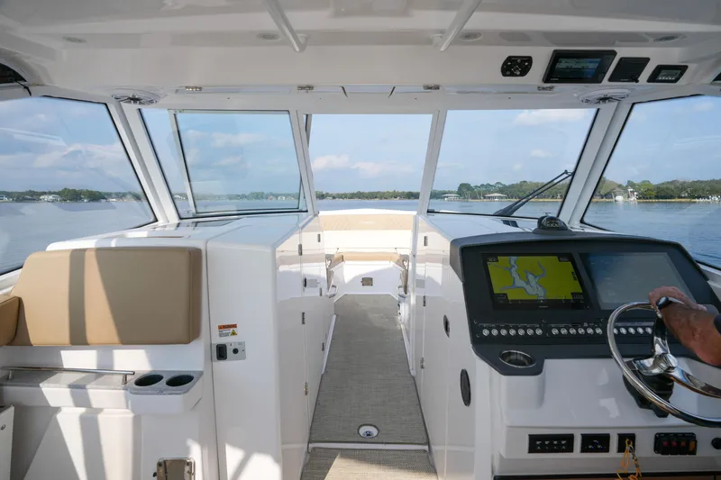 Slide: The Image of 2023 Everglades 340 Dual Console boat interior with sink, speakers, and control panel. - 11