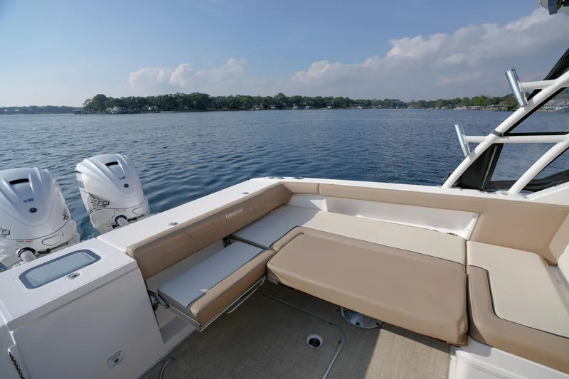 Slide: The Image of 2023 Everglades 340 Dual Console boat grill and storage compartment with rope. - 25