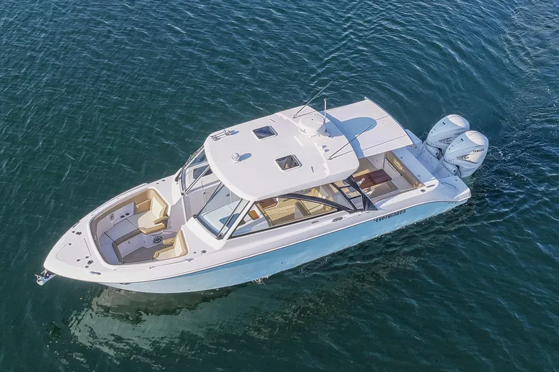 Slide: The Image of 2023 Everglades 340 Dual Console boat on water, aerial view. - 47