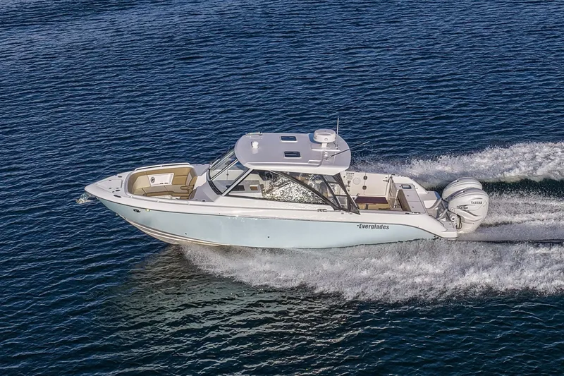 Slide: The Image of 2023 Everglades 340 Dual Console boat cruising on open water. - 55